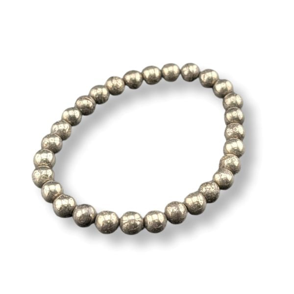 A beaded stretch bracelet made of metallic, textured silver beads, shown on a clean white background with a soft drop shadow.