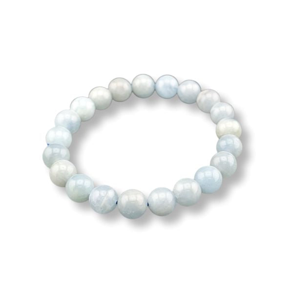 A beaded stretch bracelet made of smooth, round pearls in soft pastel shades of light blue, white, and pale gray, arranged in a circle on a white background.