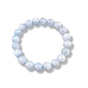 A beaded stretch bracelet made of light blue faceted round beads, displayed on a clean white background with a soft drop shadow.