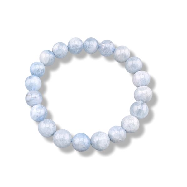 A beaded stretch bracelet made of light blue faceted round beads, displayed on a clean white background with a soft drop shadow.
