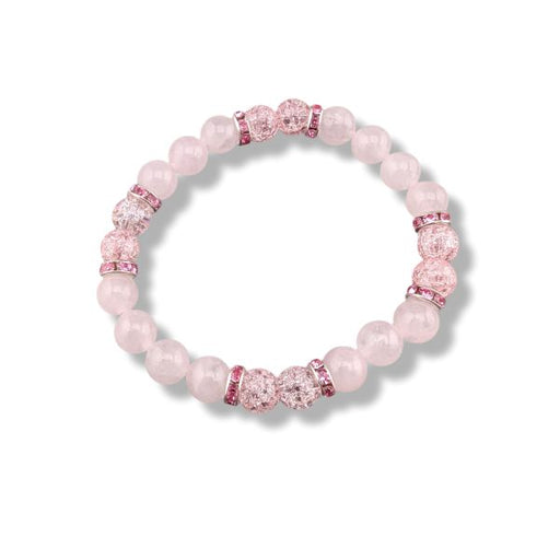 A pink beaded stretch bracelet featuring light pink round beads, faceted pink crystal beads, and silver-toned spacers, shown on a clean white background.