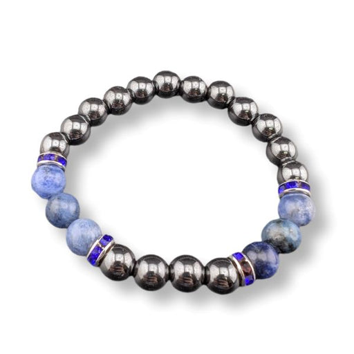 A beaded stretch bracelet featuring metallic dark gray gunmetal beads, light blue sodalite beads, and small blue and silver spacer rings, shown on a white background.