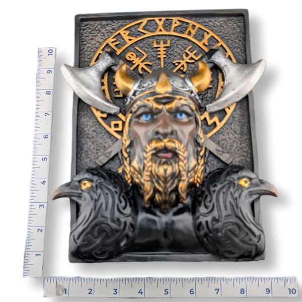 A Viking warrior wall bookshelf decor featuring a horned helmet, beard, blue eyes, and raven details, shown with metal rulers on the left and bottom to indicate dimensions against a white background.