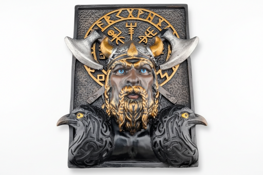 A Viking-themed decorative bookshelf decor featuring a sculpted horned warrior face with blue eyes, gold beard and helmet details, silver horns, two black ravens at the base, and a gold runic-style emblem on a dark textured rectangular panel, shown against a plain white background.