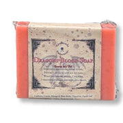 A wrapped bar of soap labeled 'Dragons Blood Soap' on a white background