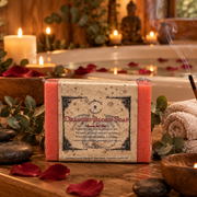 Dragon's Blood soap on a wooded table near a bath tub