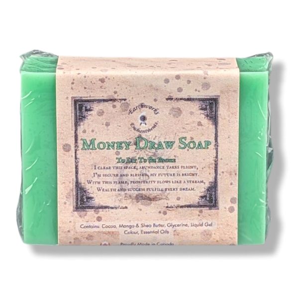 A wrapped bar of soap labeled 'Money Draw Soap' photographed on a white background.
