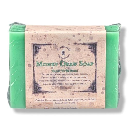 A wrapped bar of soap labeled 'Money Draw Soap' photographed on a white background.
