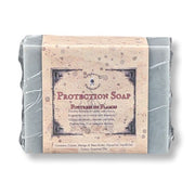 A wrapped bar of soap labeled 'Protection Soap'  photographed on a white background.