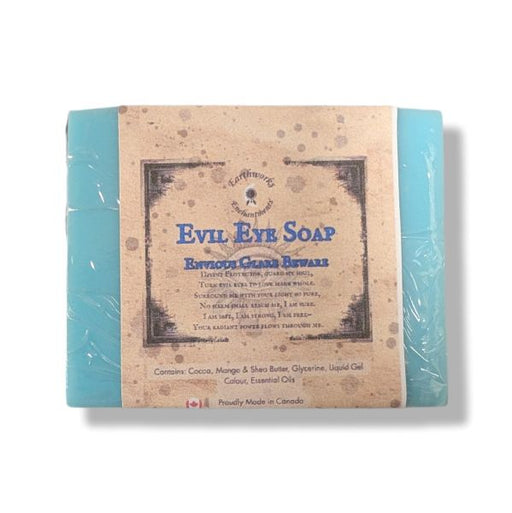 A wrapped bar of Evil Eye Soap, featuring a rustic tan paper label with blue text, on a white background.