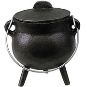 Black cast iron pot with lid on a white background