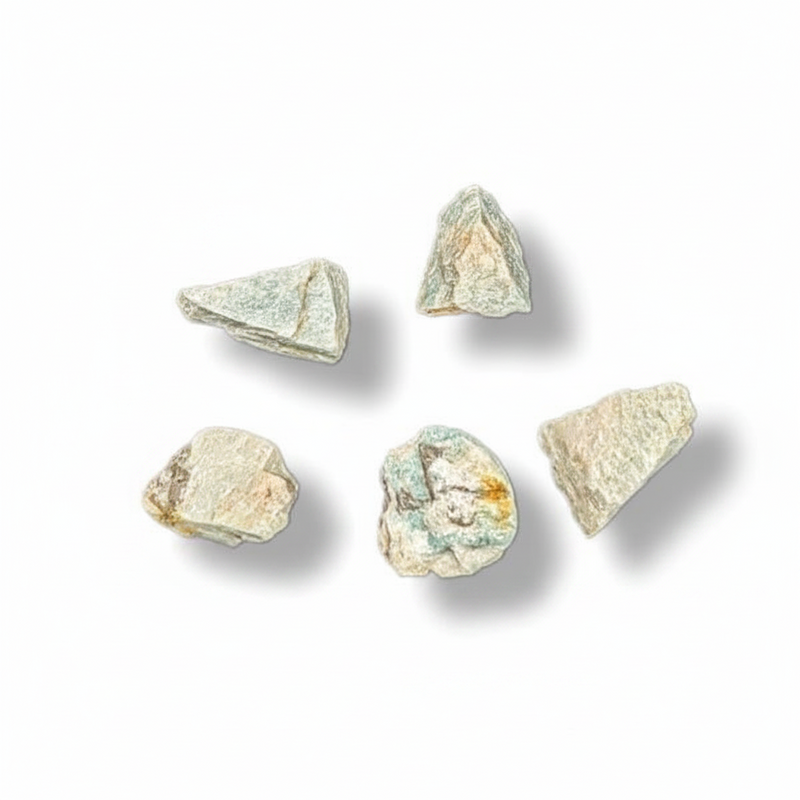 Five small rough mineral or stone pieces in pale green, beige, and off-white tones arranged on a white background with soft drop shadows.