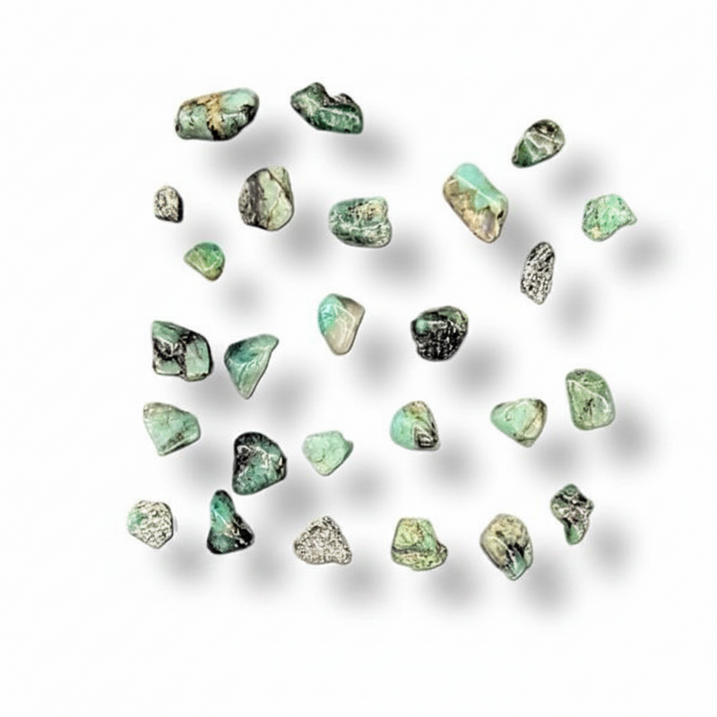Scattered green stones on a white background