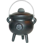 Black cauldron with a pentagram symbol on a white background