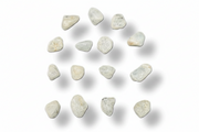 A set of small, irregular polished stones or chips in off-white and light gray, arranged in a loose circular pattern on a white background with soft drop shadows.