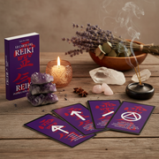 Reiki cards on a wooden surface with a candle, crystals, and incense.