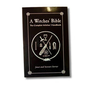 Book titled 'A Witches' Bible' with a black cover and white text on a white background