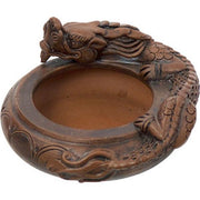 Ceramic dragon-shaped ashtray on a white background