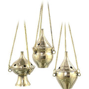 Three brass incense burners with chains on a white background