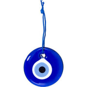 Blue evil eye pendant with a white dot on a white background