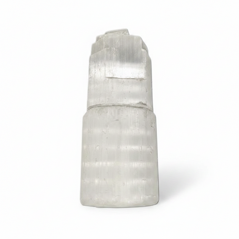 A natural selenite crystal cluster with a stepped, tiered structure, shown on a clean white background.