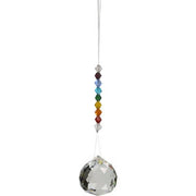 Crystal ball with colorful beads on a white background
