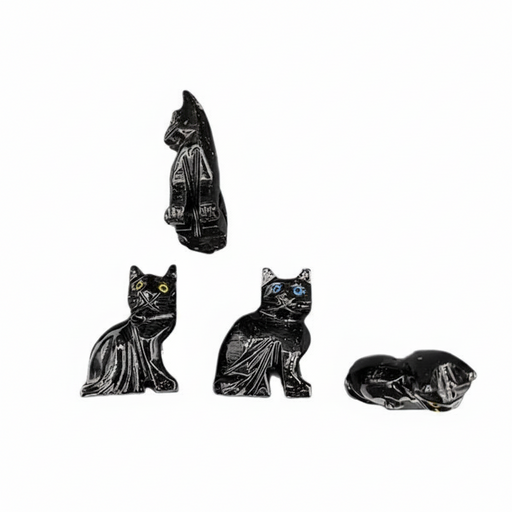 Set of four black cat figurines on a white background
