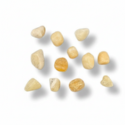 Ten small, irregular polished orange calcite pieces in pale cream, beige, and warm yellow tones arranged on a white background with soft drop shadows.