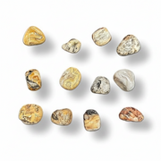Nine polished tumbled gemstones in various earthy colors and patterns, arranged in a 3x3 grid on a white background with soft drop shadows.