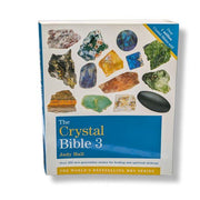 Book titled 'The Crystal Bible 3' by Judy Hall with images of crystals on the cover.