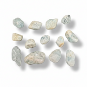 Set of light-colored stones on a white background