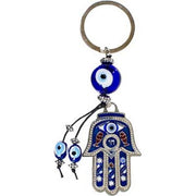 Keychain with Hamsa hand and evil eye beads on a white background