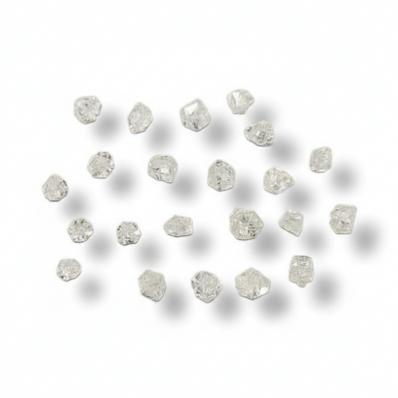 A set of small, rough-cut clear gemstones arranged in a loose circle on a white background with soft drop shadows.