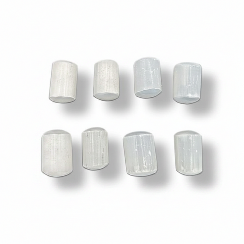 White Selenite rocks on a white background