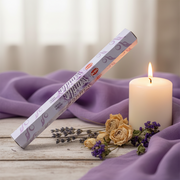 Box of Vanilla-flavored incense sticks on a white background with candles and a dried flower display