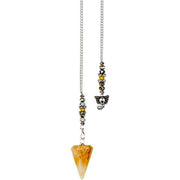 Pendulum with a yellow crystal on a white background