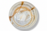 A round onyx bowl with a glossy finish, featuring a marbled pattern of white, beige, and brown concentric rings, photographed from a top-down perspective on a white background.