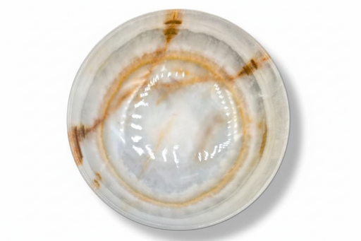 A round onyx bowl with a glossy finish, featuring a marbled pattern of white, beige, and brown concentric rings, photographed from a top-down perspective on a white background.