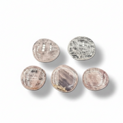 Five round rose quartz stones  on a white background