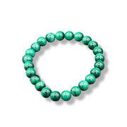 Green beaded bracelet on a white background
