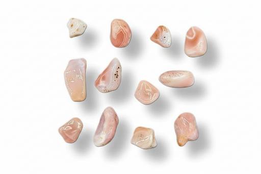 Ten polished tumbled stones in soft peach, pink, cream, and light beige tones, arranged on a clean white background with subtle drop shadows.