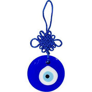 Blue evil eye charm with a white circle and black dot on a white background