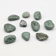 Nine polished tumbled gemstone tumbled in a speckled green and white pattern, with two darker gray stones, arranged on a plain white background.