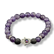 Purple beaded bracelet with a Hamsa hand charm on a white background