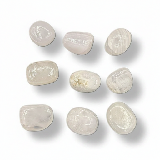 Nine smooth, polished tumbled stones in a light cream to off-pink color, arranged in a 3x3 grid on a white background with soft drop shadows.