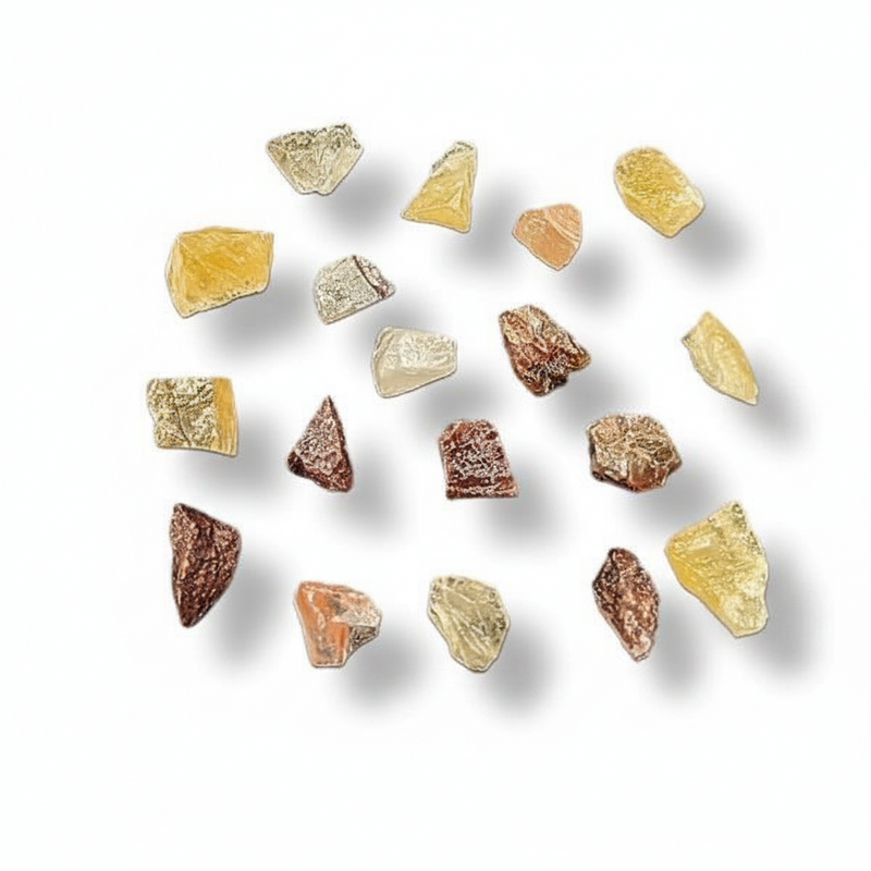 A set of 15 raw, rough-cut mineral or gemstone chips in various colors and shapes, arranged on a clean white background with soft drop shadows.