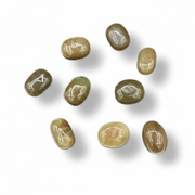 Nine polished oval gemstones in earthy olive, tan, and brown tones arranged on a white background with soft drop shadows.