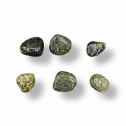 Set of six green stones on a white background