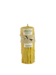 Beeswax candle with a label on a white background