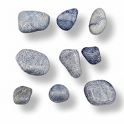 Nine polished tumbled stones in shades of slate blue, navy, and gray with white veining, arranged on a clean white background with soft drop shadows.